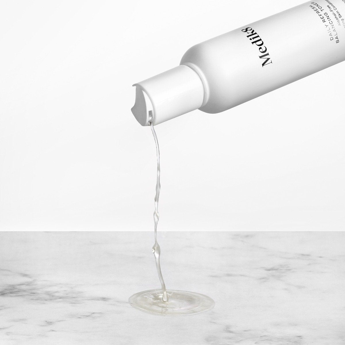 "Daily Refresh Balancing Toner™ by Medik8. A Hydrating Skin Conditioner with Floral Waters"